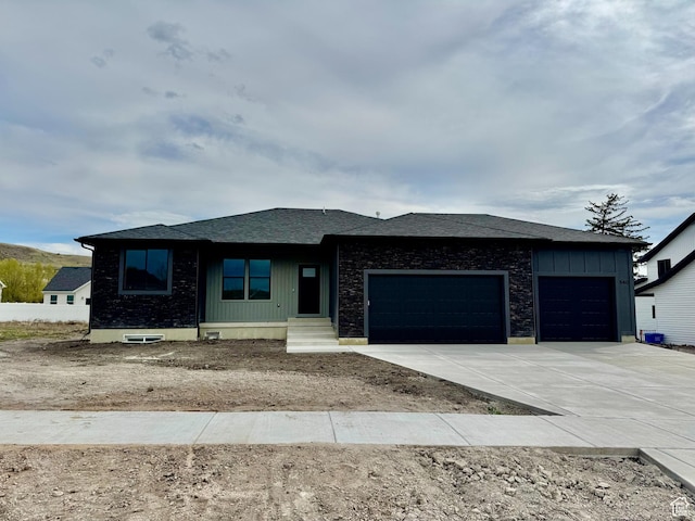 prairie-style home with a garage and concrete driveway