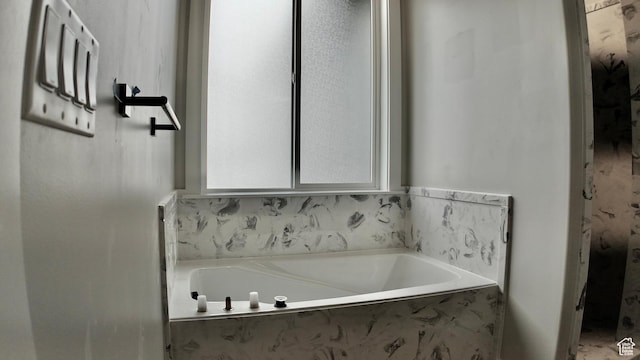 bathroom with a garden tub