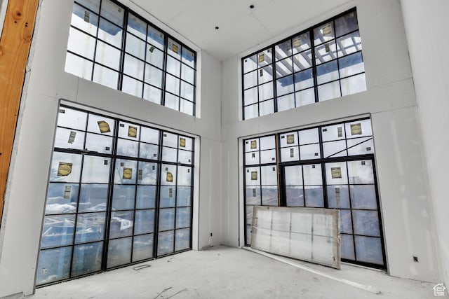 spare room featuring a high ceiling