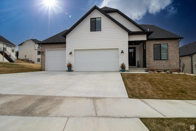 1438 N Jerry Gertsch Ln, Midway, UT 84049 - view of front facade with a front yard, brick siding, concrete driveway, and a garage