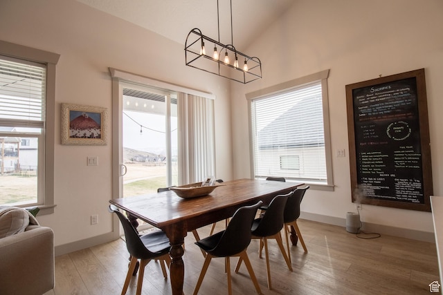1438 N Jerry Gertsch Ln, Midway, UT 84049 - dining room with baseboards, a chandelier, vaulted ceiling, and light wood-style floors