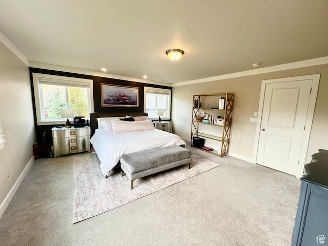 bedroom featuring light colored carpet, recessed lighting, crown molding, and baseboards