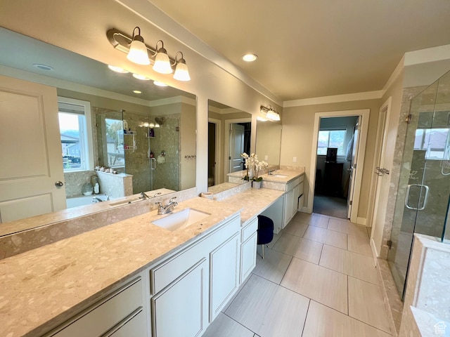 bathroom with a shower stall, ornamental molding, vanity, and a garden tub