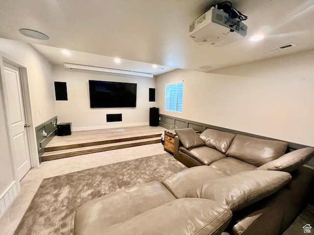 cinema with wood finished floors, recessed lighting, baseboards, and visible vents