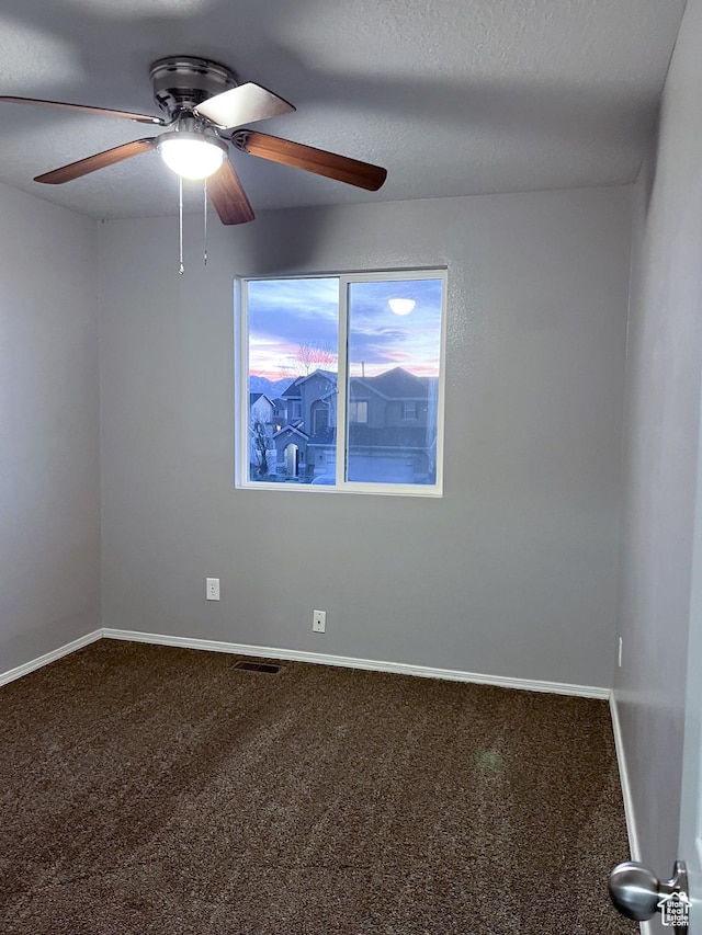 5498 Scarsborough Way, Stansbury Park, UT 84074 - unfurnished room with ceiling fan, carpet floors, baseboards, and a textured ceiling