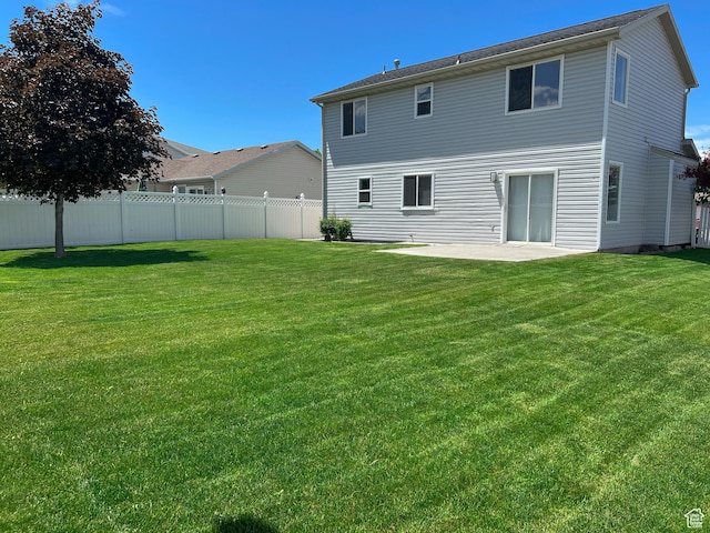 5498 Scarsborough Way, Stansbury Park, UT 84074 - back of house with a patio area
