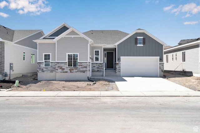 253 E Polaris Dr Unit 105, Saratoga Springs, UT 84045 - craftsman-style house with board and batten siding, driveway, stone siding, and an attached garage