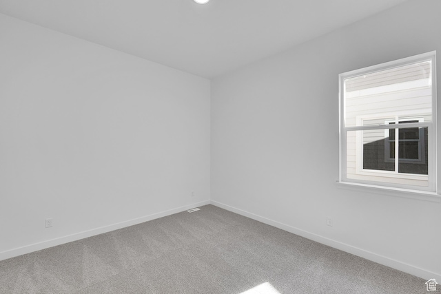 253 E Polaris Dr Unit 105, Saratoga Springs, UT 84045 - carpeted spare room featuring baseboards