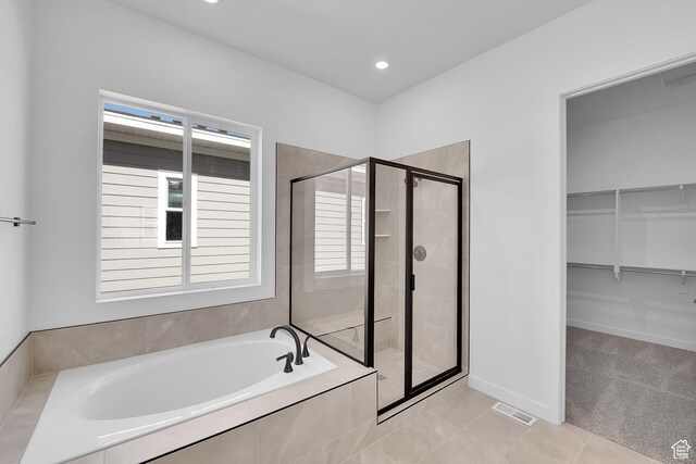 253 E Polaris Dr Unit 105, Saratoga Springs, UT 84045 - full bath with a garden tub, a shower stall, a spacious closet, recessed lighting, and tile patterned floors