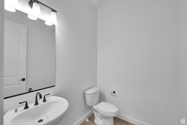 253 E Polaris Dr Unit 105, Saratoga Springs, UT 84045 - bathroom featuring a sink and wood finished floors