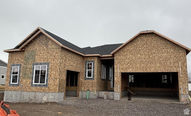 unfinished property with an attached garage