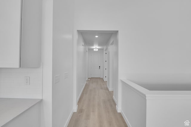 3198 S Blue Heron Dr E Unit 609, Saratoga Springs, UT 84045 - corridor featuring light wood-style flooring and baseboards