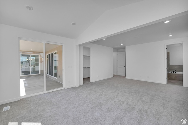 3198 S Blue Heron Dr E Unit 609, Saratoga Springs, UT 84045 - unfurnished bedroom featuring carpet, lofted ceiling, a walk in closet, and recessed lighting