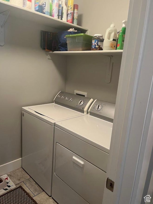 1869 Southpointe Ct, Logan, UT 84341 - laundry room featuring washing machine and dryer, laundry area, and light tile patterned floors
