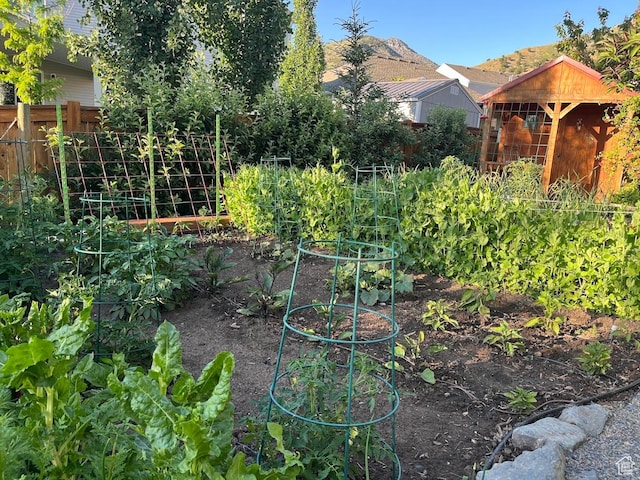 1869 Southpointe Ct, Logan, UT 84341 - view of yard featuring fence and a vegetable garden