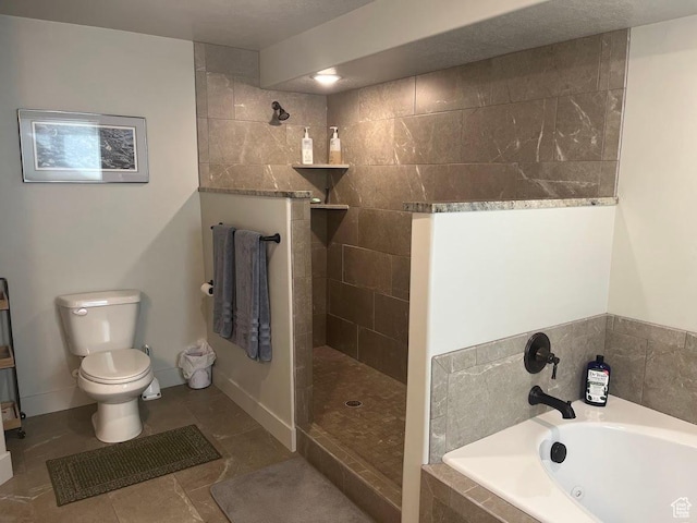 1869 Southpointe Ct, Logan, UT 84341 - bathroom with toilet, baseboards, tile patterned floors, a garden tub, and walk in shower