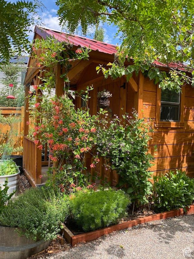 1869 Southpointe Ct, Logan, UT 84341 - view of side of home featuring metal roof