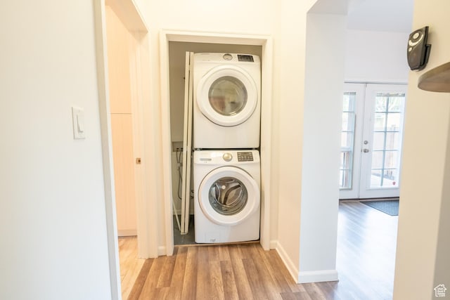 1197 S 700 E, Salt Lake City, UT 84105 - washroom with stacked washer and clothes dryer, wood finished floors, french doors, and baseboards