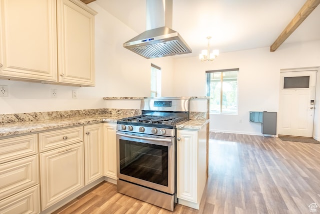 1197 S 700 E, Salt Lake City, UT 84105 - kitchen with stainless steel range with gas stovetop, ventilation hood, light wood-style flooring, a chandelier, and light stone counters