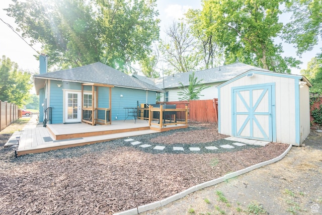 1197 S 700 E, Salt Lake City, UT 84105 - back of house with a fenced backyard, a storage unit, a wooden deck, and an outdoor structure