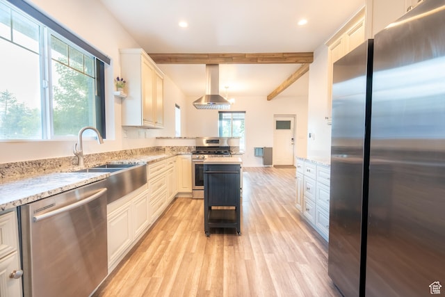 1197 S 700 E, Salt Lake City, UT 84105 - kitchen featuring stainless steel appliances, extractor fan, light wood-type flooring, beamed ceiling, and a peninsula
