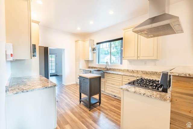 1197 S 700 E, Salt Lake City, UT 84105 - kitchen with wall chimney range hood, healthy amount of natural light, light wood finished floors, recessed lighting, and a sink