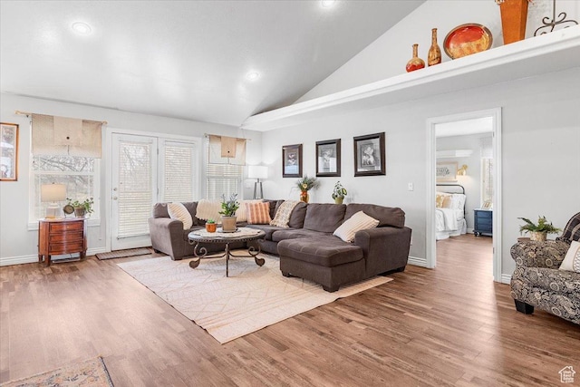 living area with baseboards, high vaulted ceiling, wood finished floors, and recessed lighting