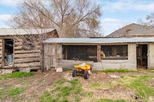 view of side of property with an outbuilding and exterior structure