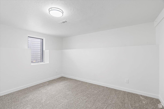4880 S 4380 W, Salt Lake City, UT 84118 - carpeted spare room with a textured ceiling, baseboards, and visible vents