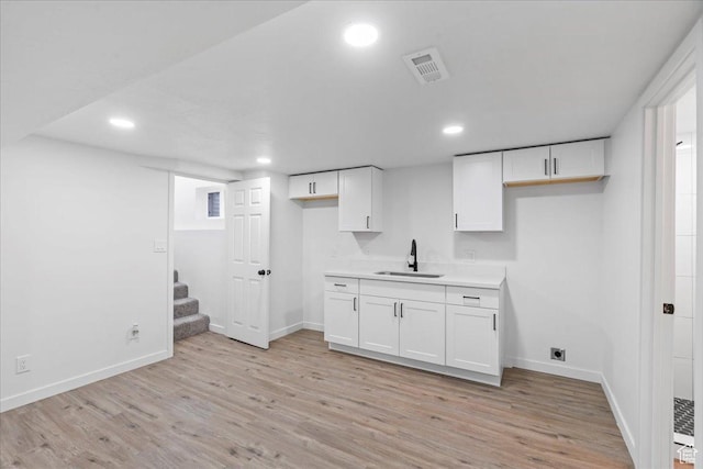 4880 S 4380 W, Salt Lake City, UT 84118 - interior space with visible vents, light wood finished floors, baseboards, recessed lighting, and a sink