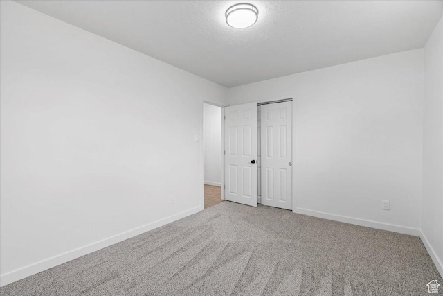 4880 S 4380 W, Salt Lake City, UT 84118 - spare room with baseboards, a textured ceiling, and carpet