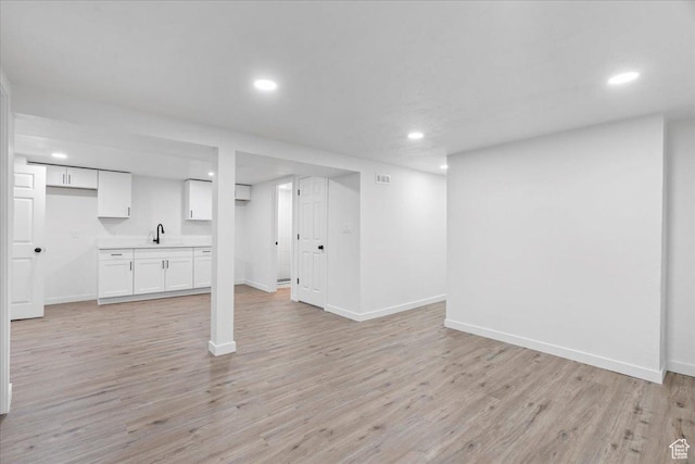 4880 S 4380 W, Salt Lake City, UT 84118 - finished below grade area with baseboards, light wood finished floors, and recessed lighting