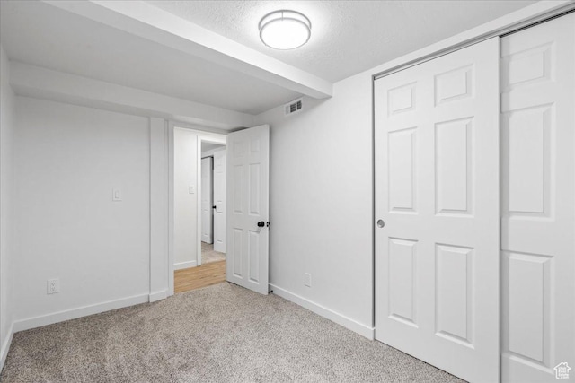 4880 S 4380 W, Salt Lake City, UT 84118 - unfurnished bedroom featuring carpet flooring, baseboards, a textured ceiling, visible vents, and a closet