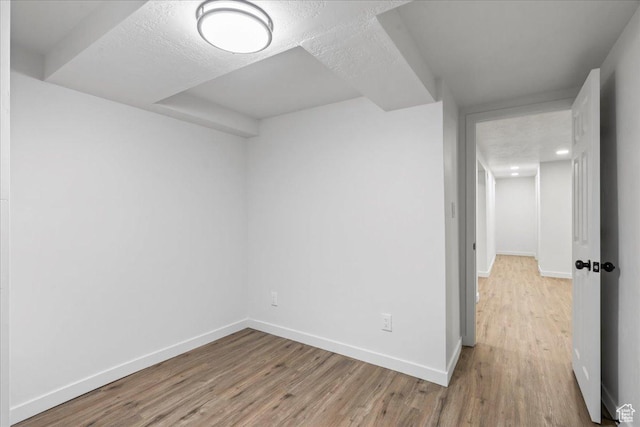 4880 S 4380 W, Salt Lake City, UT 84118 - empty room with baseboards, a textured ceiling, and light wood-type flooring