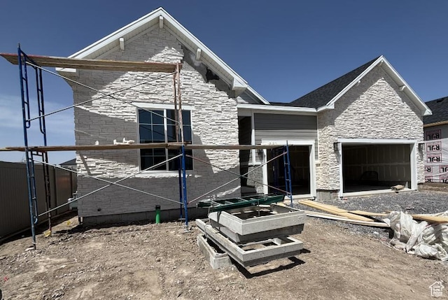 234 E Polaris Dr Unit 108, Saratoga Springs, UT 84045 - view of front of house with a garage and stone siding