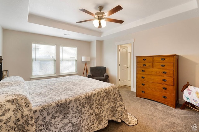 4143 W Gate Keeper Dr, Herriman, UT 84096 - bedroom featuring a tray ceiling, carpet floors, a ceiling fan, and baseboards