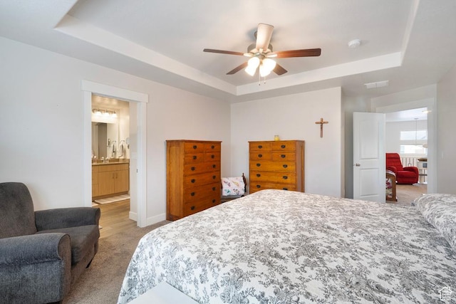 4143 W Gate Keeper Dr, Herriman, UT 84096 - bedroom featuring a raised ceiling, light colored carpet, ceiling fan, and ensuite bathroom