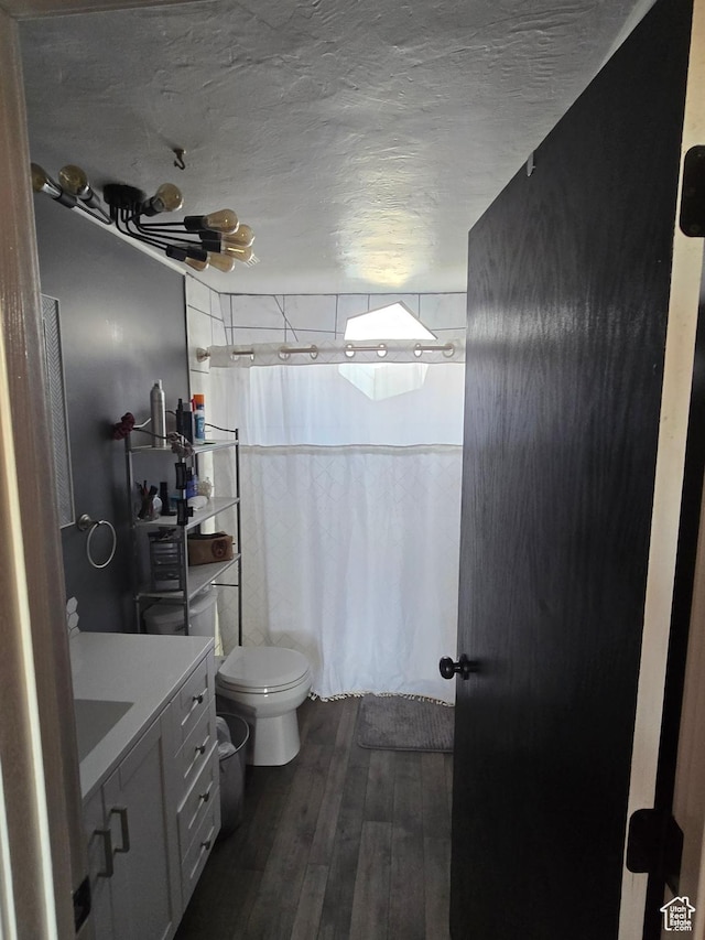 3379 S 1750 E, Price, UT 84501 - full bathroom featuring a shower with curtain, wood finished floors, toilet, and a textured ceiling