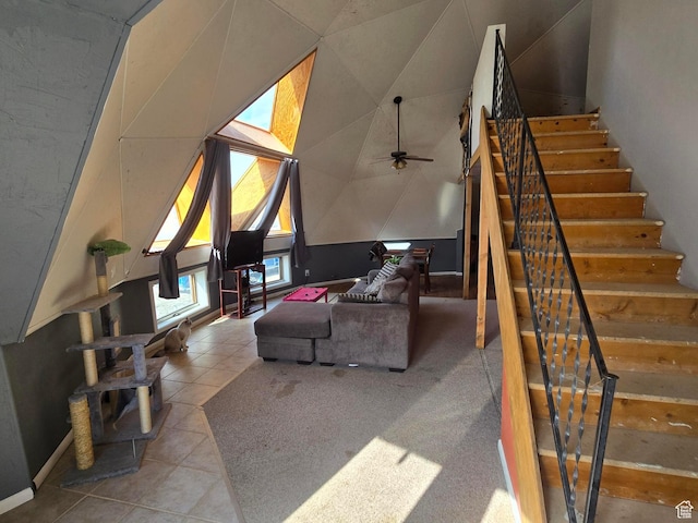 3379 S 1750 E, Price, UT 84501 - living room with tile patterned floors, vaulted ceiling, stairway, and a ceiling fan