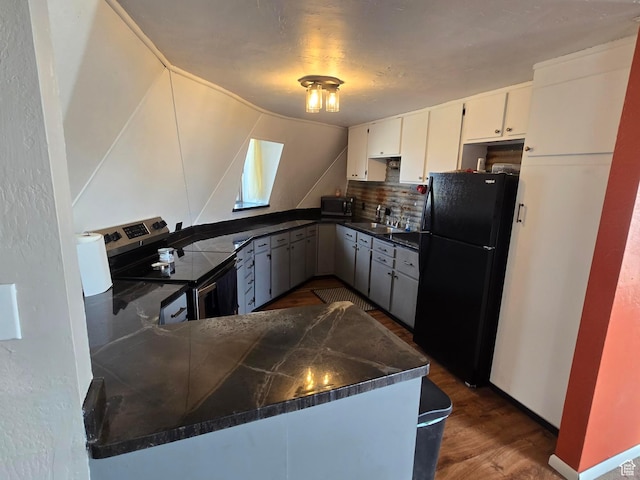 3379 S 1750 E, Price, UT 84501 - kitchen with backsplash, a sink, dark countertops, dark wood-style floors, and appliances with stainless steel finishes
