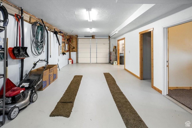 792 S Spruce Dr S, Garden City, UT 84028 - garage featuring baseboards