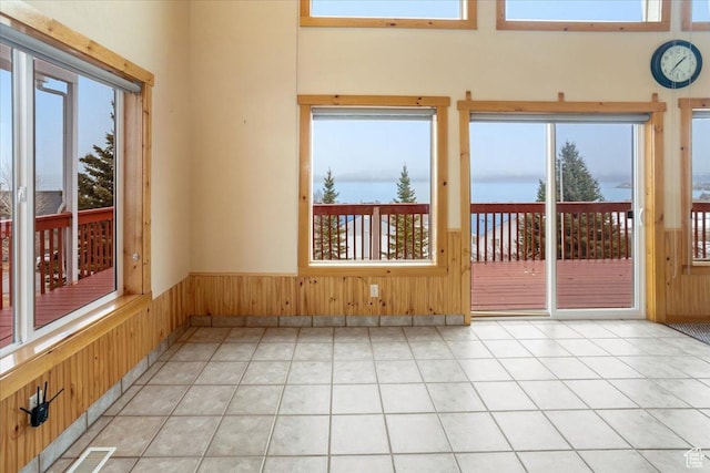 792 S Spruce Dr S, Garden City, UT 84028 - unfurnished sunroom featuring wainscoting, wooden walls, and visible vents