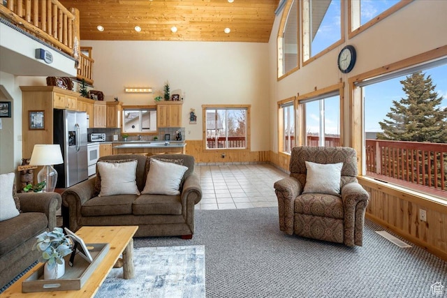 792 S Spruce Dr S, Garden City, UT 84028 - living area with a high ceiling, light tile patterned flooring, wooden ceiling, and visible vents