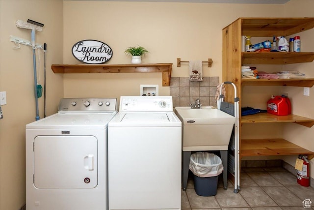 792 S Spruce Dr S, Garden City, UT 84028 - laundry room with independent washer and dryer, laundry area, and light tile patterned floors