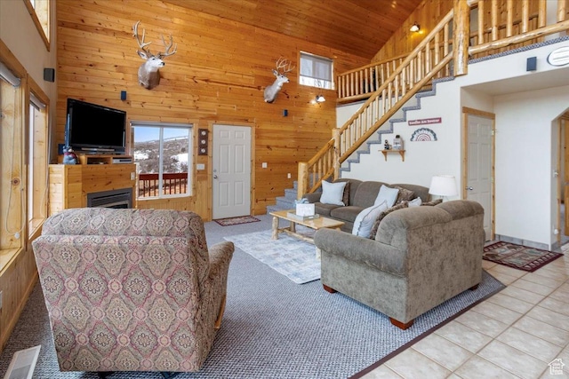 792 S Spruce Dr S, Garden City, UT 84028 - living room featuring stairs, high vaulted ceiling, wood ceiling, wooden walls, and visible vents