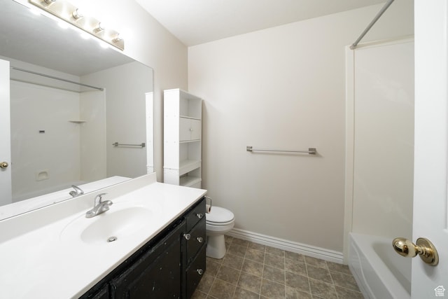 full bathroom with baseboards, toilet, shower / bathing tub combination, and vanity