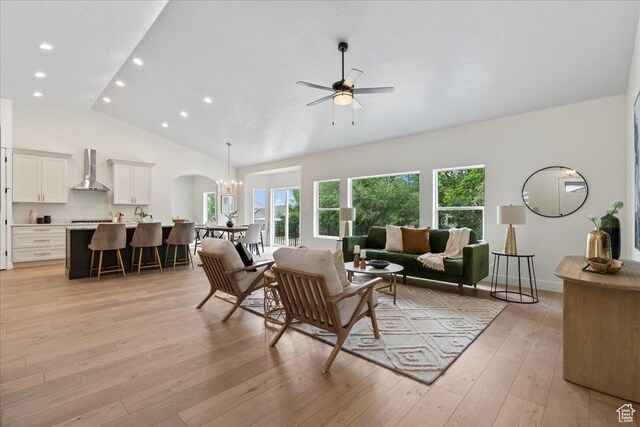 3779 S Old Wood, West Valley City, UT 84120 - living area featuring a ceiling fan, recessed lighting, light wood-style flooring, arched walkways, and a chandelier