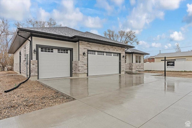 3779 S Old Wood, West Valley City, UT 84120 - view of front of house featuring an attached garage, concrete driveway, fence, and a shingled roof