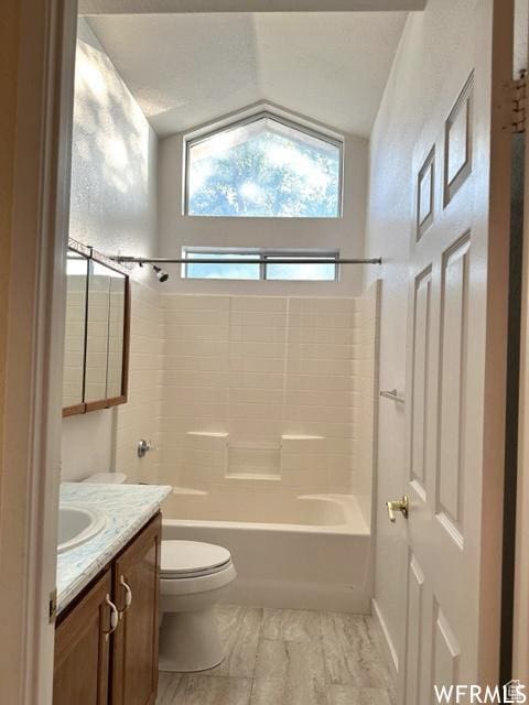 2103 S Mountain Vista Ln E, Provo, UT 84606 - full bath with toilet, vanity, lofted ceiling, and bathtub / shower combination