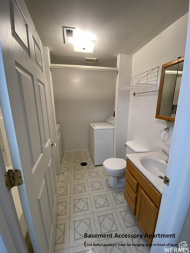 2103 S Mountain Vista Ln E, Provo, UT 84606 - bathroom with a shower, toilet, vanity, and visible vents